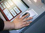 Finger-vein recognition also uses near-infrared light and patterning, but the device used to read the finger is smaller, merely allowing the tip of the finger to be read by a sensor. (Photo provided by Hitachi-Omron Transaction Systems.)